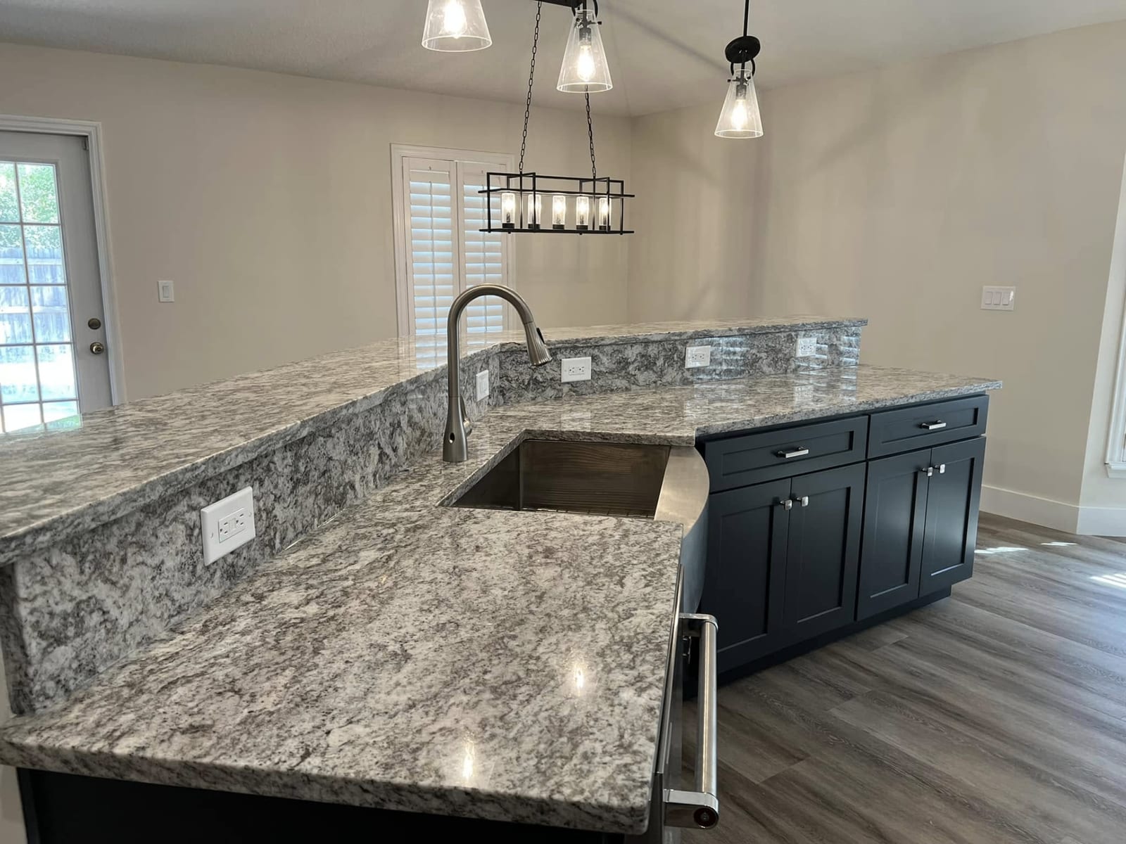 Custom white waterfall kitchen island countertop